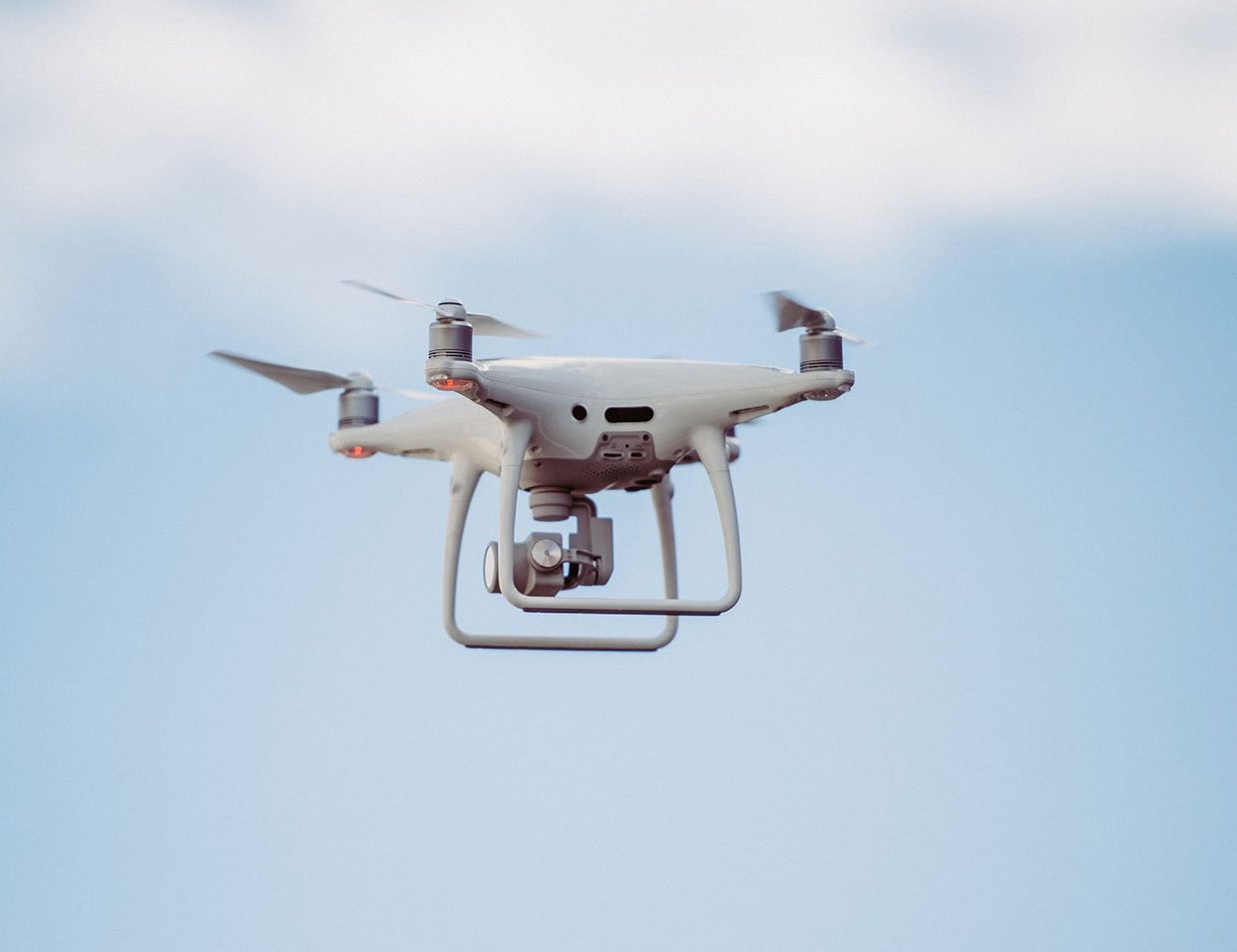 white drone in mid air
